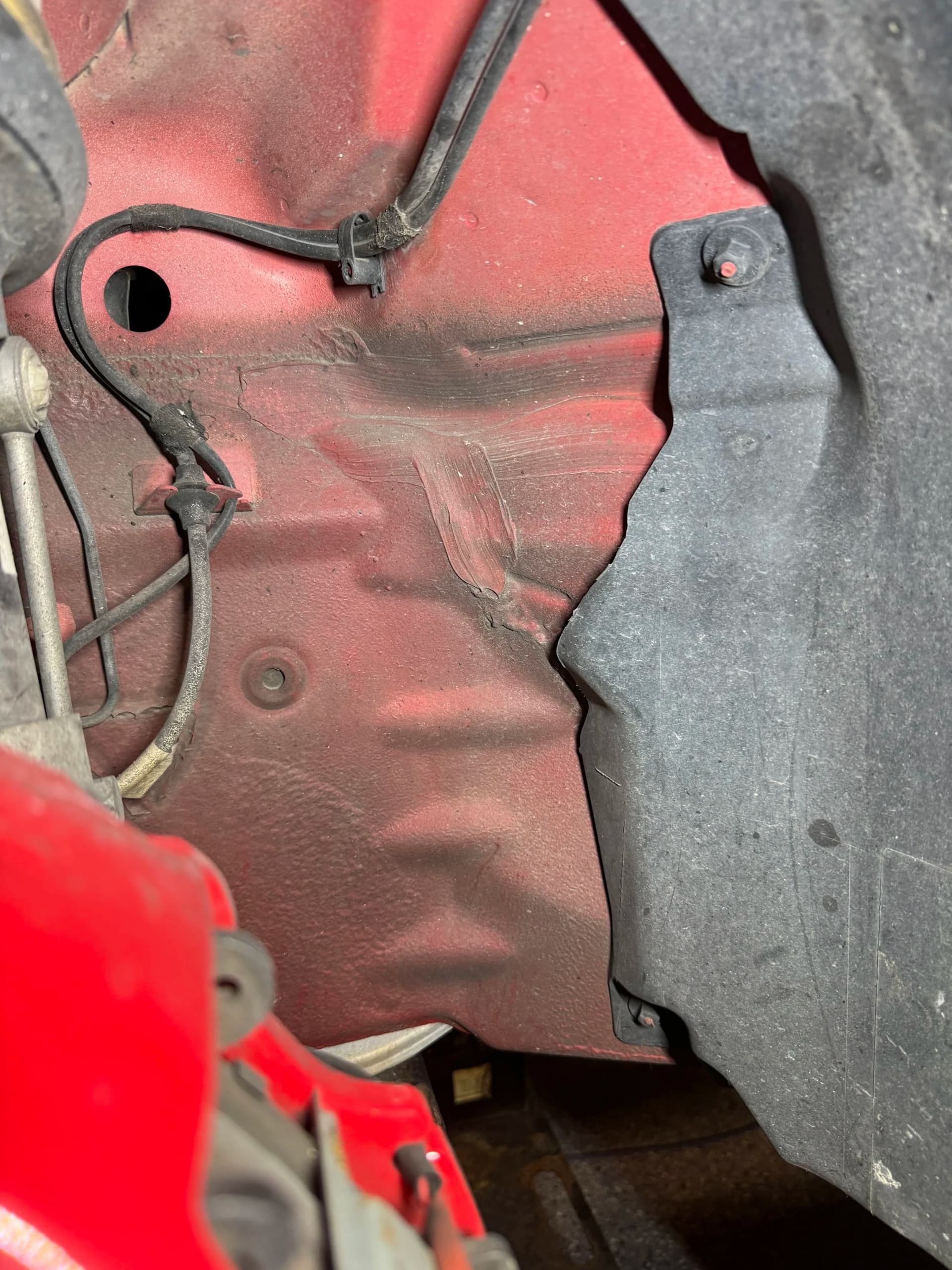 Porsche 911 Wheel Well before dry ice blasting in Milwaukee